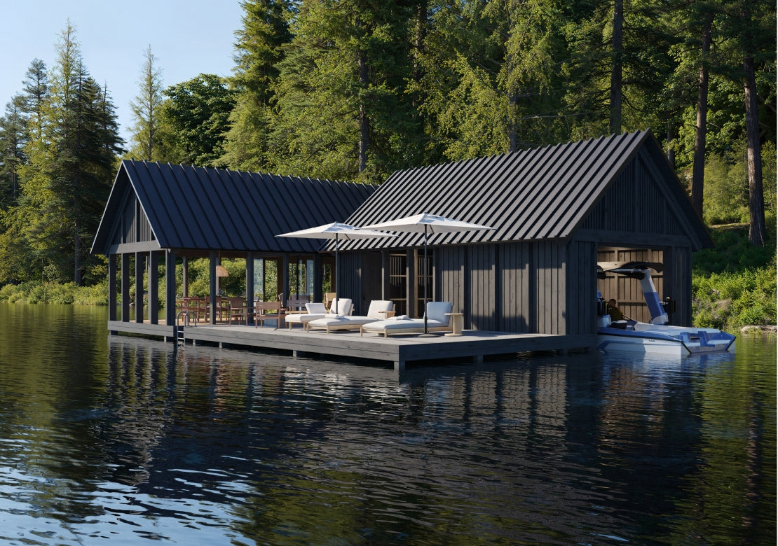 Modern cabin on a lake with a dock and outdoor furniture, surrounded by trees.