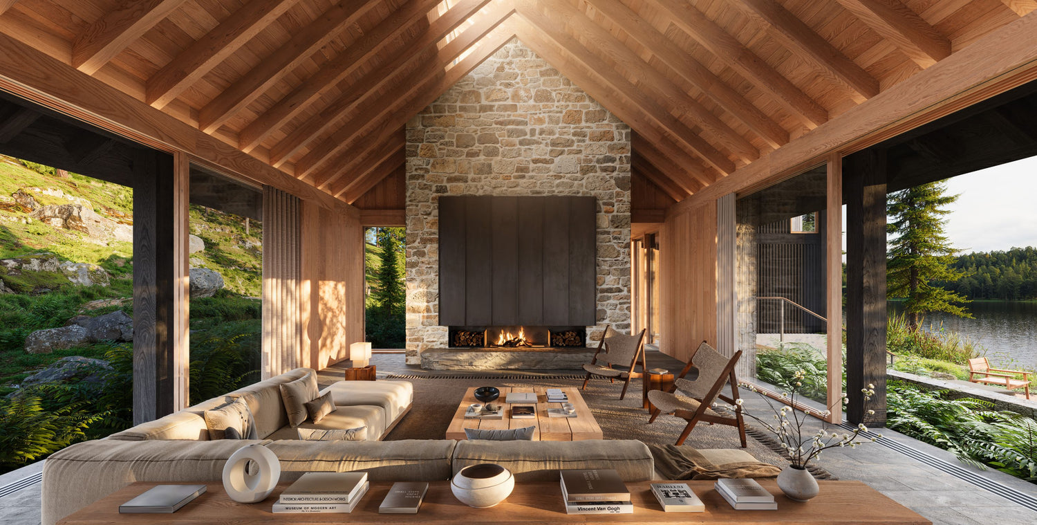Modern cabin interior with stone fireplace, wooden furniture, and scenic view.